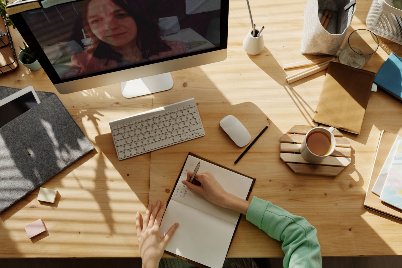 Care check-in on a video call while taking notes